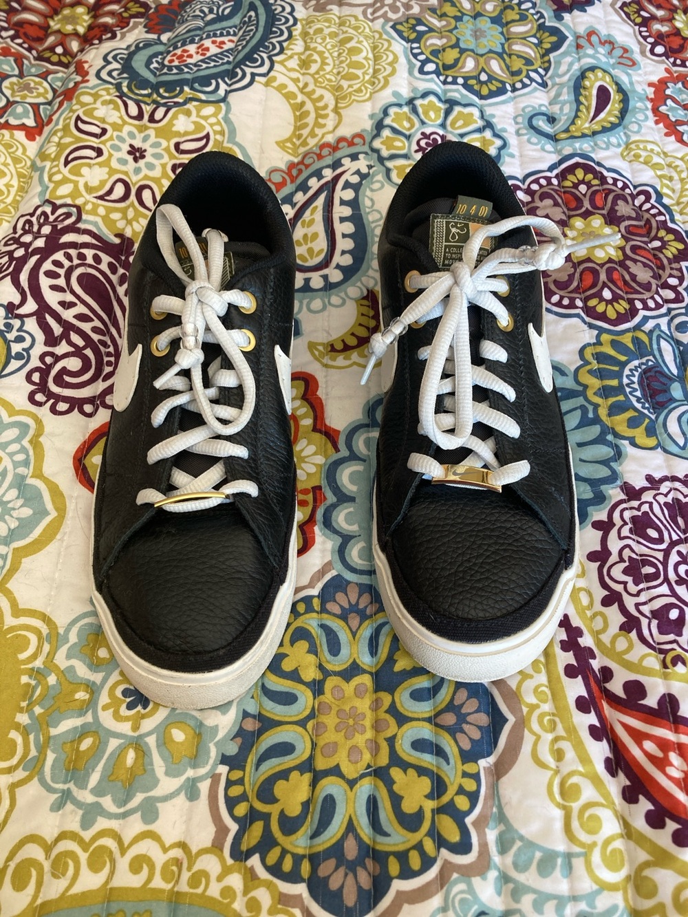 Nike Women’s Black & White Low-Top Sneakers with Gold Lace Tips